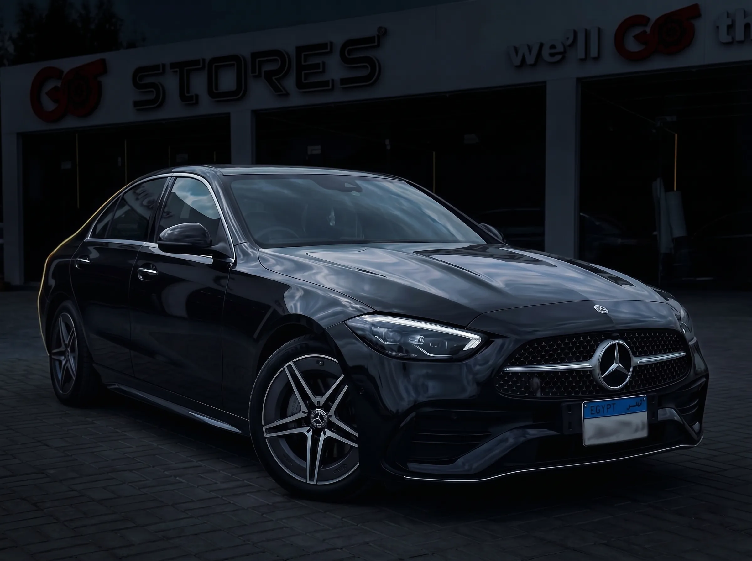 Black Mercedes C-Class, dusk grading — GO Black Edition tier
